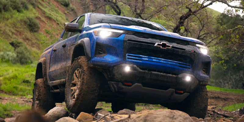 2026 Chevrolet Colorado climbing a rocky trail