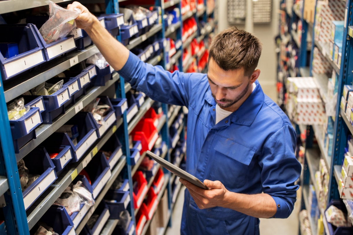 Image of service technician searching for parts in the parts department