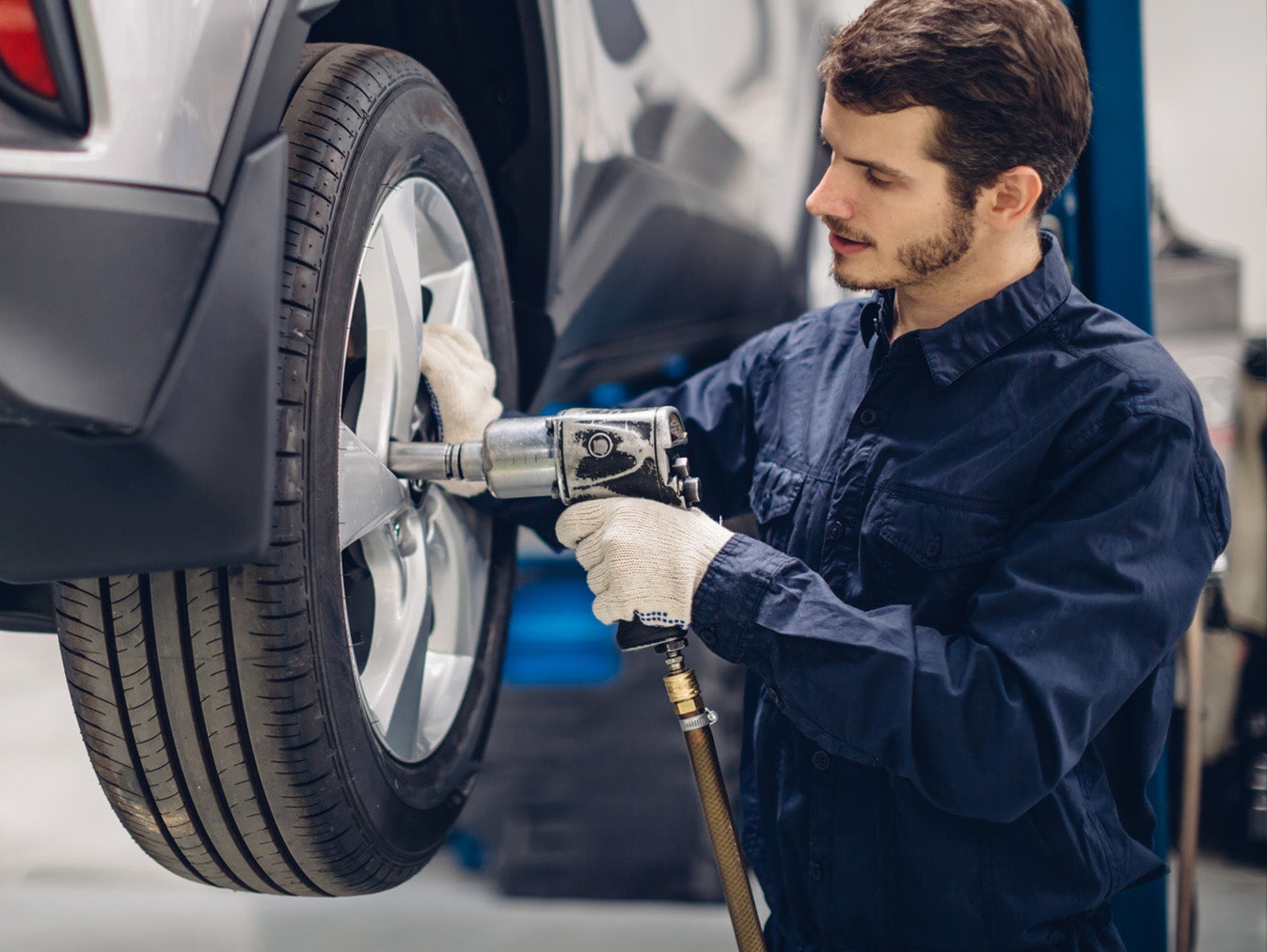 Image of service technician opening the vehicle tire